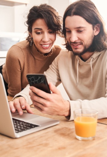 Couple completing a lease purchase application online